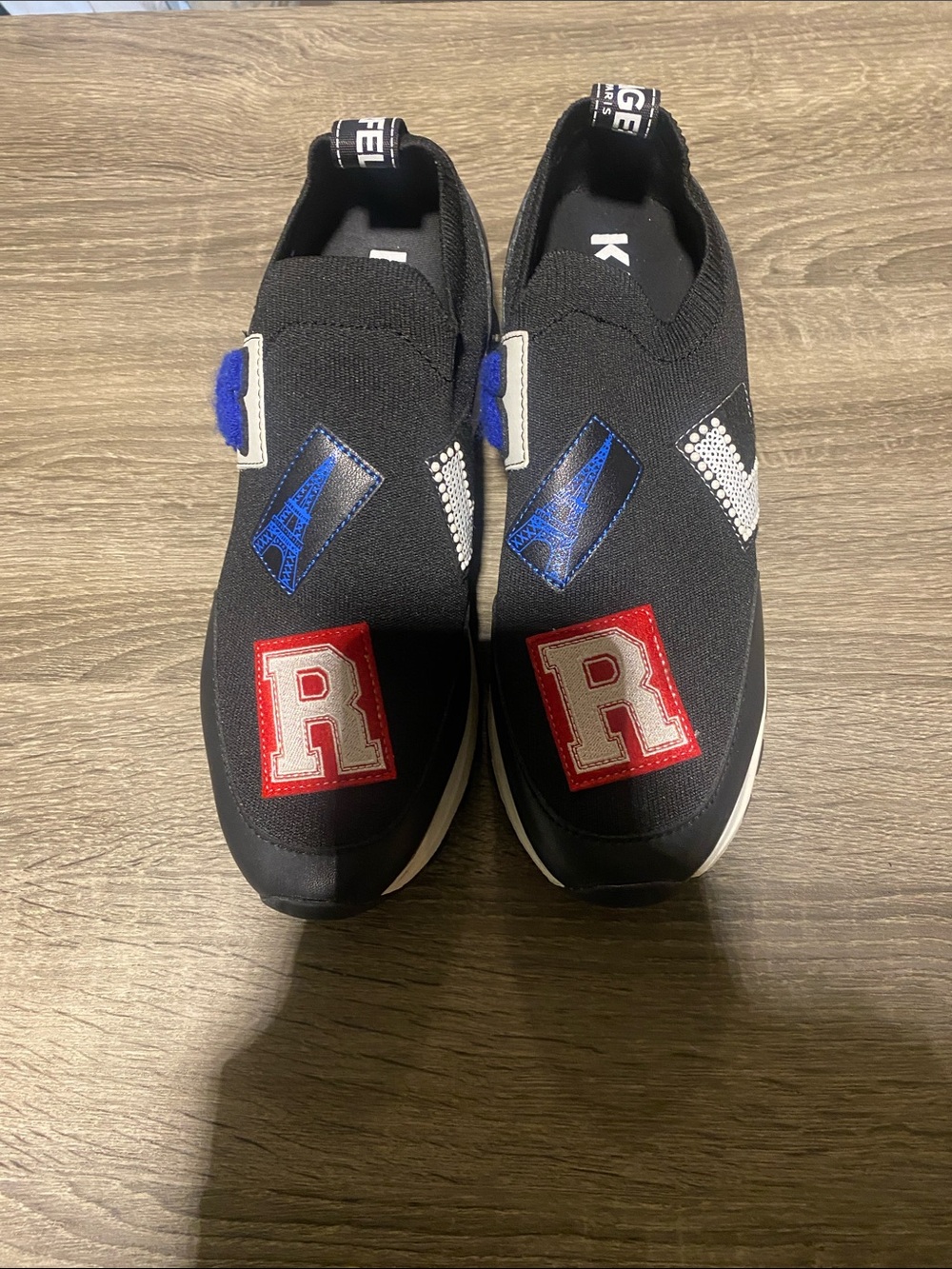 Black Slip-On Sneakers with Red 'R' Patches
